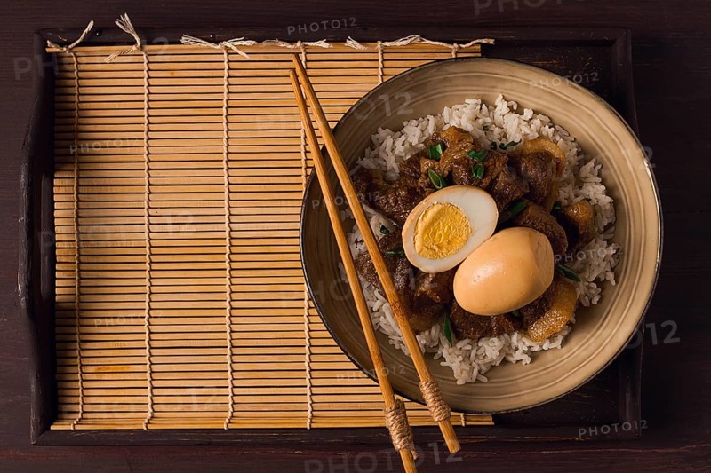 Stewed eggs, with pork belly, and rice, chinese food, homemade, selective focus, rustic, no people