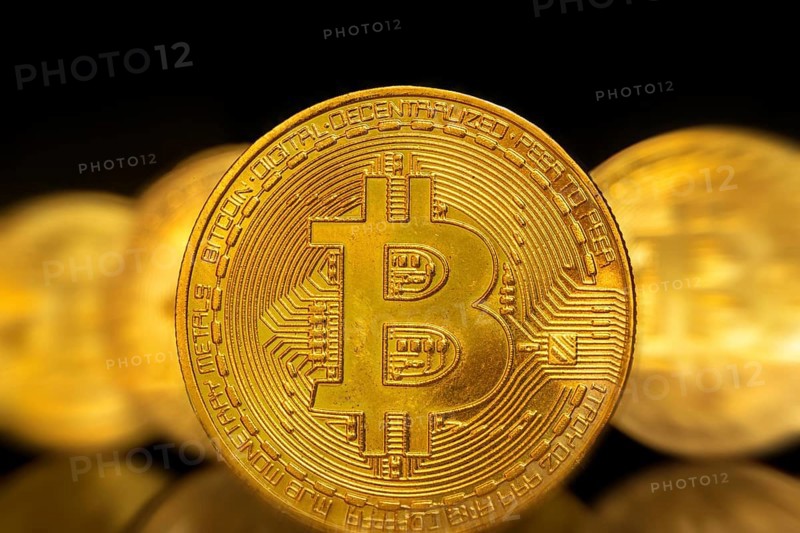 Close-up of symbolic bitcoins