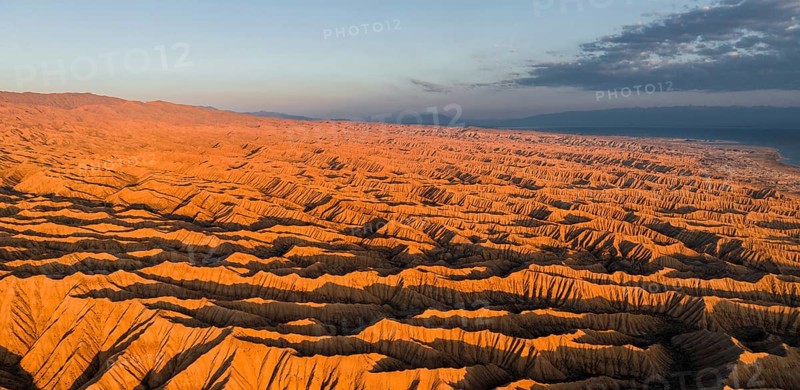 Landscape of eroded hills at Lake Issyk Kul, Badlands at sunrise, aerial view, Canyon of the Forgotten Rivers, Issyk Kul, Kyrgyzstan, Asia
