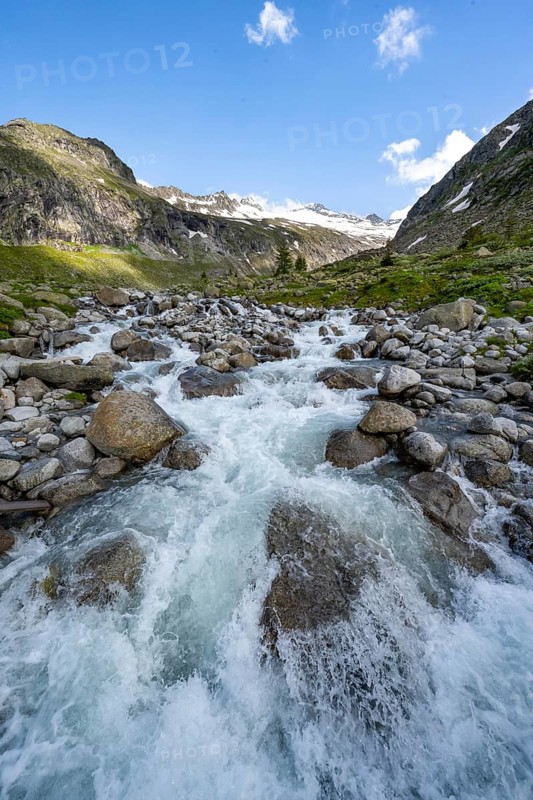 Mountain stream Hornkeesbach, behind mountain peak with snow and glacier Hornkees, Berliner Höhenweg, Zillertal Alps, Tyrol, Austria, Europe
