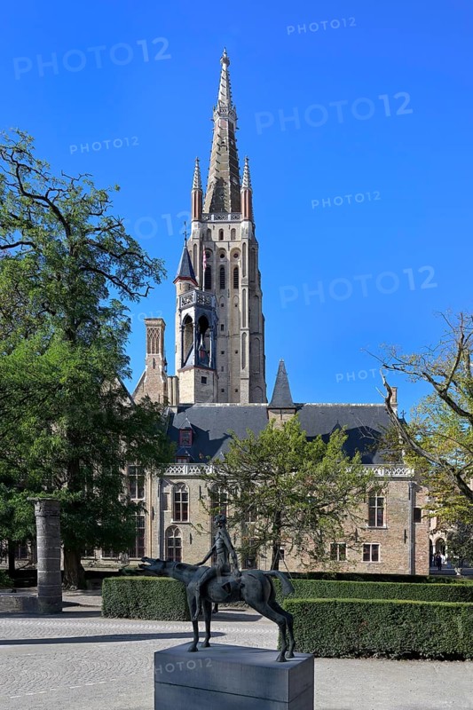 Church of Our Lady and the statue of one of the Four Horsemen of the Apocalypse, Bruges, Flanders, Belgium, Europe