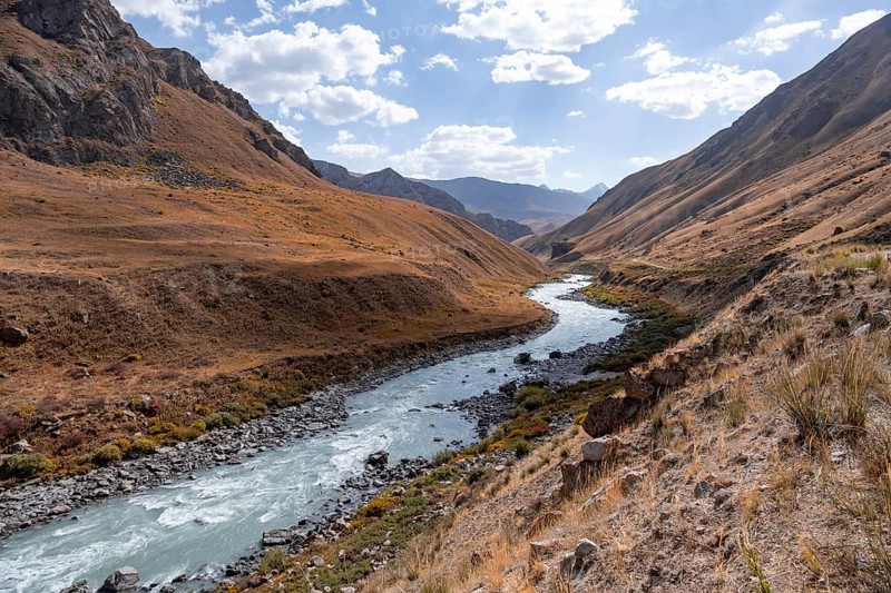 Mountain valley with river between golden meadows, Bolgart Valley, Naryn Province, Kyrgyzstan, Asia