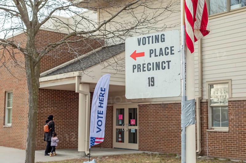 Deaarborn, Michigan USA, 27 February 2024, A voter and her child arrive to vote at Geer Park School in Michigan's Presidential primary election. Especially in Hamtramck and Dearborn, where there are large numbers of Arab-Americans, many voters planned to vote uncommitted in the Democratic primary.. Many Arab-Americans are furious about Joe Biden's support for Israel in the Gaza war