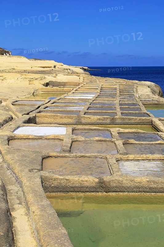 Historic ancient salt pans on coast near Marsalforn, island of Gozo, Malta, Europe