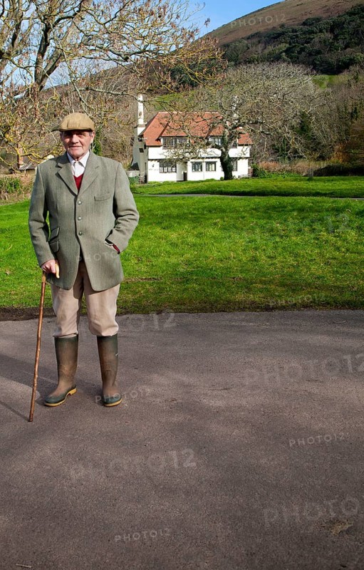 Smartly dressed gentleman out for his morning walk in Bossington, Exmoor national park, Somerset, England, United Kingdom, Europe