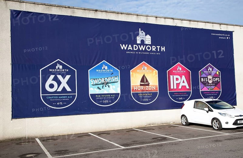 Billboard traditionally brewed beer advertising poster at Wadworth brewery, Devizes, Wiltshire, England, UK