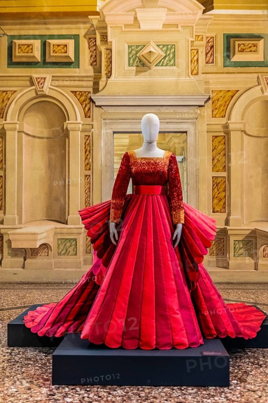 Red silk Mikado wedding dress in various shades of red with embroidered bodice, 2009, exhibition of magnificent evening dress creations by fashion designer Roberto Capucci, 17th century Villa Manin, residence of Ludovico Manin, Codroipo, Friuli, Italy, Codroipo, Friuli, Italy, Europe