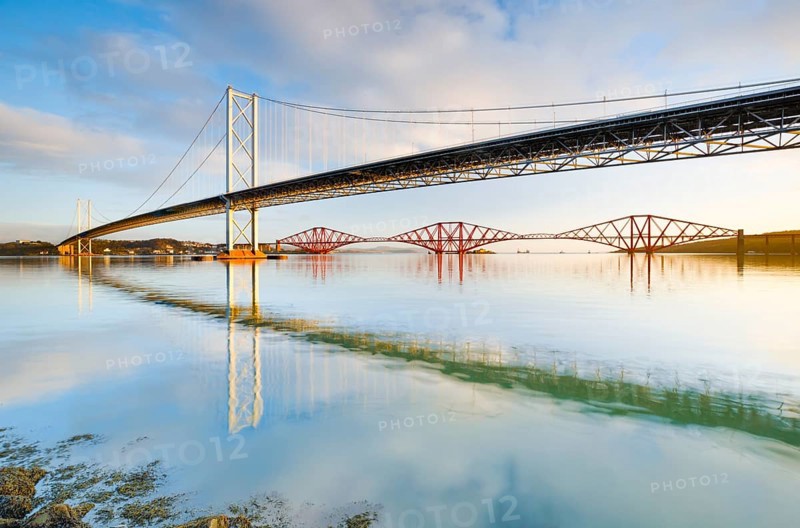 View of the Forth Road Bridge and the red railway bridge Forth Bridge at the Fírth of Forth estuary near South Queensferry, Scotland, Great Britain
