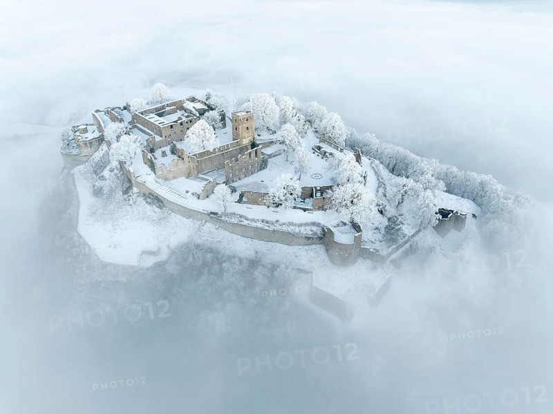 Aerial view of the Hegau volcano Hohentwiel with Germany's largest fortress ruins on a cold, foggy winter morning, in front of sunrise, Singen am Hohentwiel, district of Constance, Baden-Württemberg, Germany, Europe
