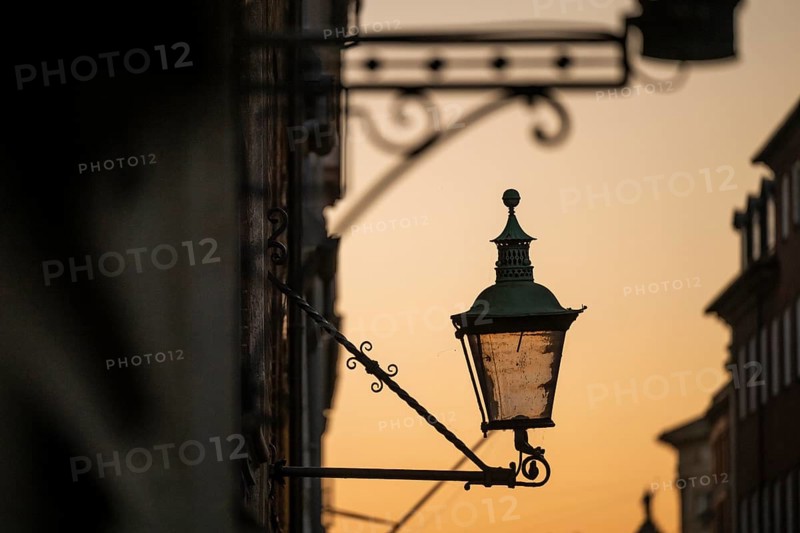 Silhouette of historic street lamp or street lantern in the evening light, nostalgic atmosphere, Copenhagen, Denmark, Europe