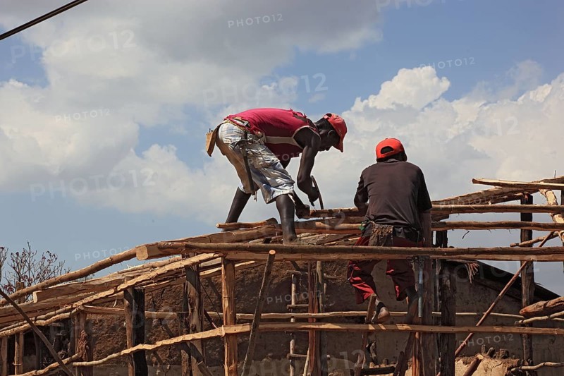 South Ethiopia, two men on a building site, house building, wooden construction, Ethiopia, Africa