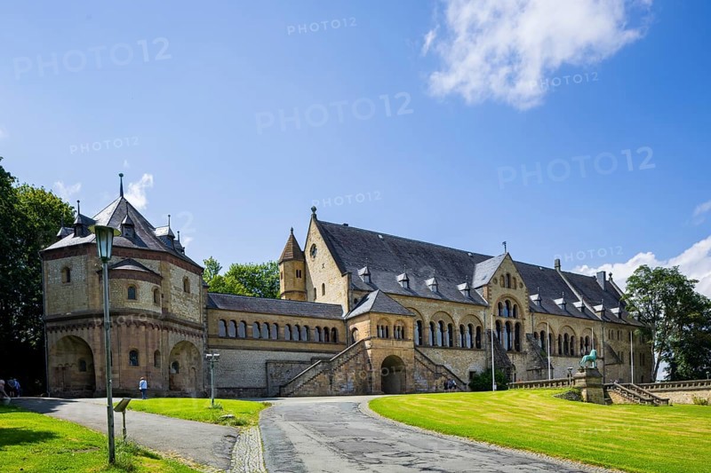 The imperial palace of Goslar covers an area of around 340 by 180 metres, situated at the foot of the Rammelsberg in the south of the town of Goslar, on which the imperial house, the former collegiate monastery St. Simon and Judas, the palace chapel of St. Ulrich and the Church of Our Lady are or were located. The imperial palace, built between 1040 and 1050 under Henry III, is a unique monument to secular architecture. For over 200 years, German and European history was written here at numerous imperial and court conventions. Copies of the Brunswick Lion and equestrian monuments in front of the imperial palace, Kaiserpfalz Goslar, Goslar, Lower Saxony, Germany, Europe