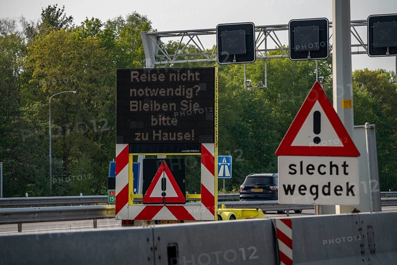 German-Dutch border at Emmerich-Elten, A3 motorway, signal board asks travellers to only make necessary journeys to the Netherlands, effects of the corona crisis in Germany