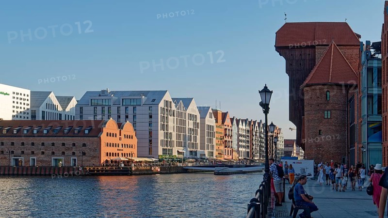 The brick and wooden Crane Gate, on the right, on the Motlawa River, is a landmark of the city of Gdansk. Gdansk, Pomerania, Poland, Europe