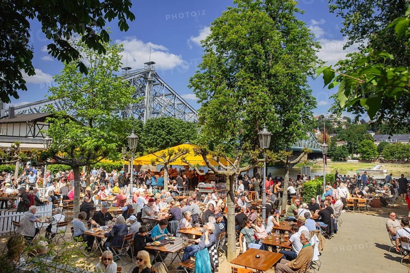 Groups of men on their way to the Men's Day on the Dresden Elbe cycle path, here the packed Schillergarten, Dresden, Saxony, Germany, Europe