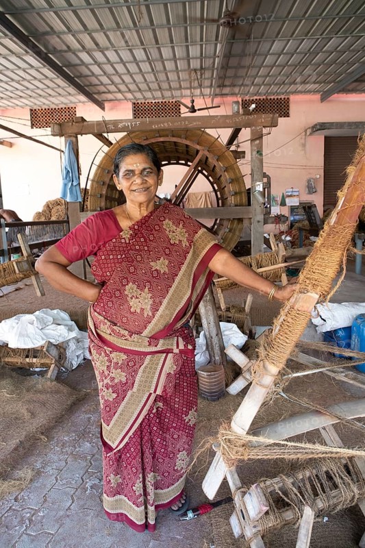 Indian worker, 59 years old, in the spinning mill of the Labourers Coir Mats and Mattings Cooperation, coir mat production, Muhamma, Alappuzha, Kerala, India, Asia