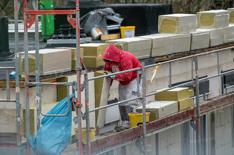 Building site, thermal insulation, external insulation, facade insulation, is attached to the facade of a new building, glued, Duisburg, North Rhine-Westphalia, Germany, Europe