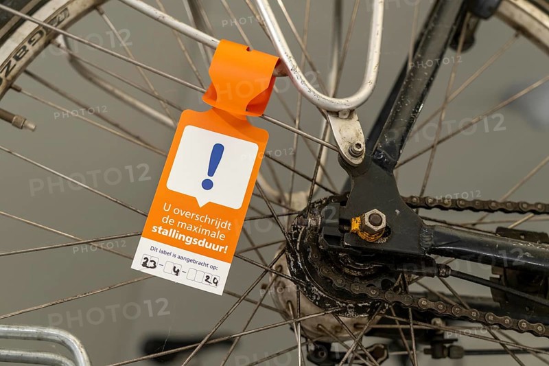 New bicycle car park at Amsterdam Central station, Stationsplein, space for around 7000 bicycles, largest in Amsterdam, digitally monitored, underground, direct connection to the station and metro, notice about overlong parking, bike will be removed soon, Netherlands
