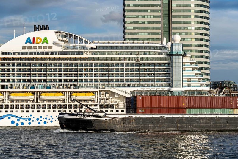 Cruise ship Aida Prima at the Cruise Terminal of Rotterdam, Kop van Zuid, high-rise buildings at the Wilhelminakade, Netherlands