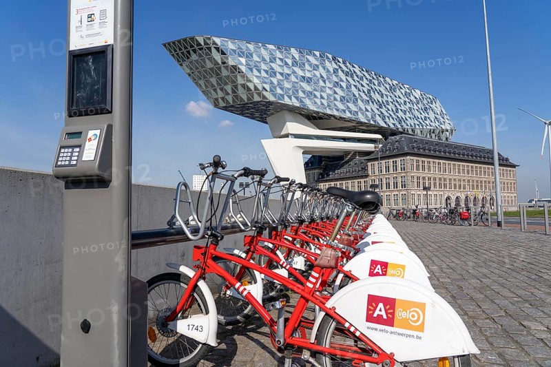 Rental station, drop zone for rental bikes, provider Velo Antwerp, place to park bikes for temporary hire, at the Havenhuis, Antwerp, Flanders, Belgium, Europe