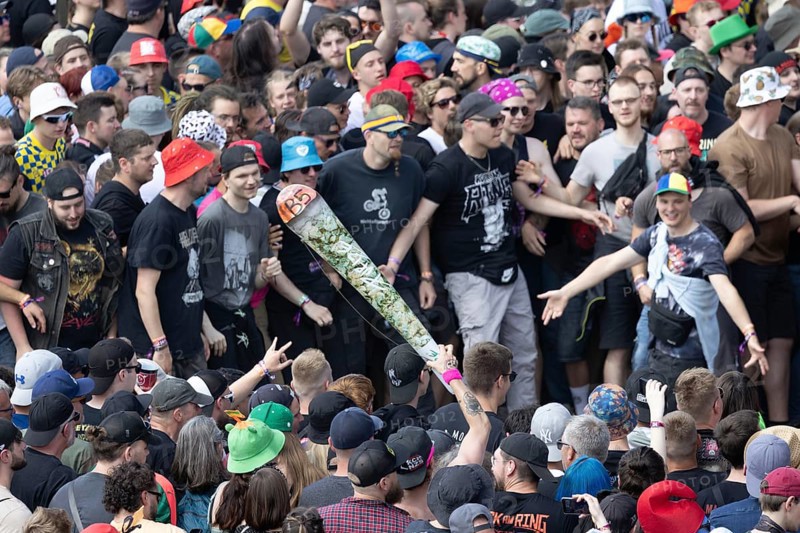 Adenau, Germany, 7 June 2024: Fans with a fake joint during the first day of Rock am Ring. The festival takes place at the Nürburgring race track near the town of Adenau from 7 to 9 June 2024, Europe