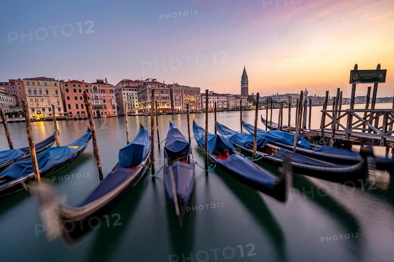 Venetian gondolas, boat dock at the customs office on the Grand Canal, Gondola Traghetto Dogana, Campanile behind, long exposure at sunrise, Venice, Veneto, Italy, Europe