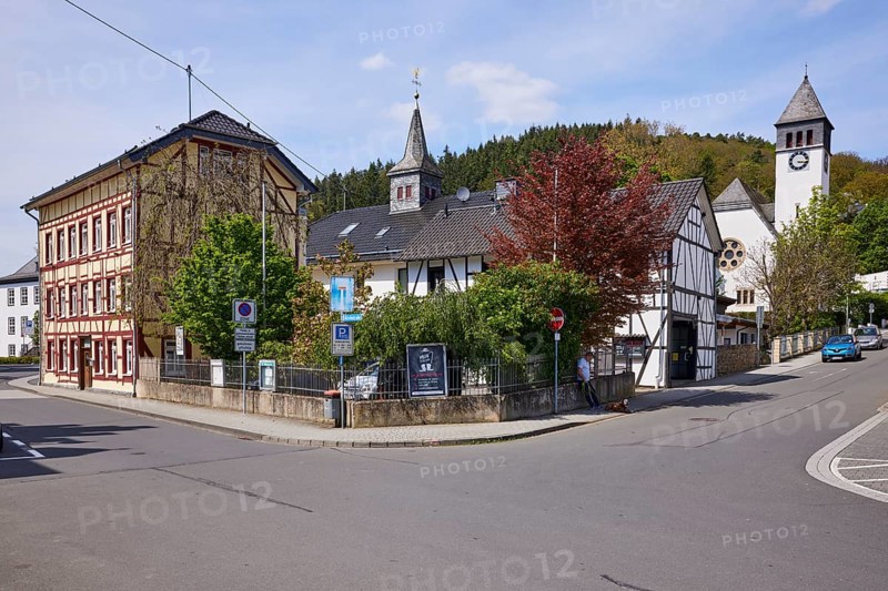Crossroads with half-timbered houses and Church of the Redeemer in Adenau, Eifel, Ahrweiler district, Rhineland-Palatinate, Germany, Europe