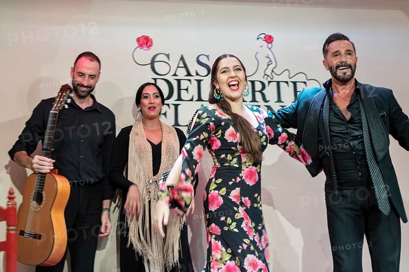 Happy flamenco group after a performance, joy and satisfaction in expression, Granada