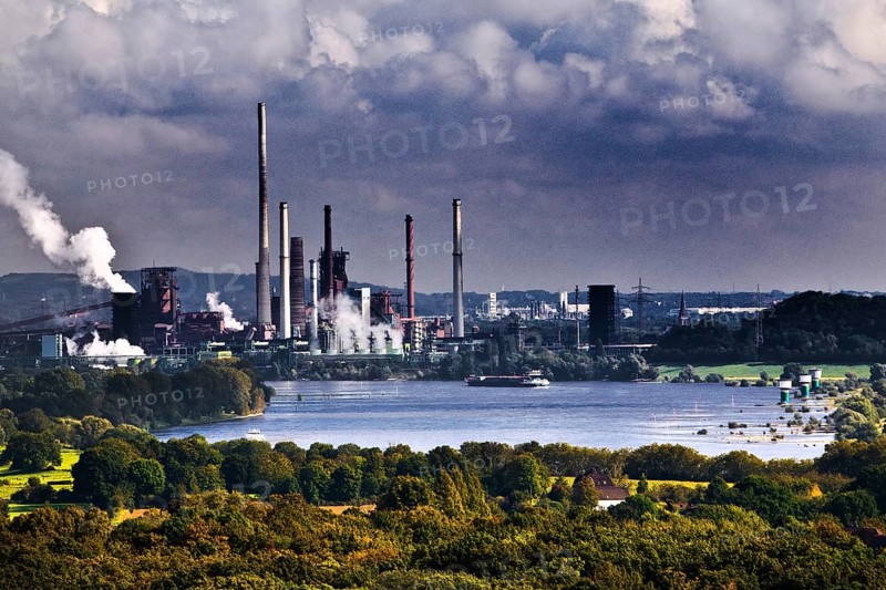 View from the Rheinpreussen spoil tip to Duisburg with ships on the Rhine and the Thyssen Krupp plant in Bruckhausen, Ruhr area, Germany, Europe