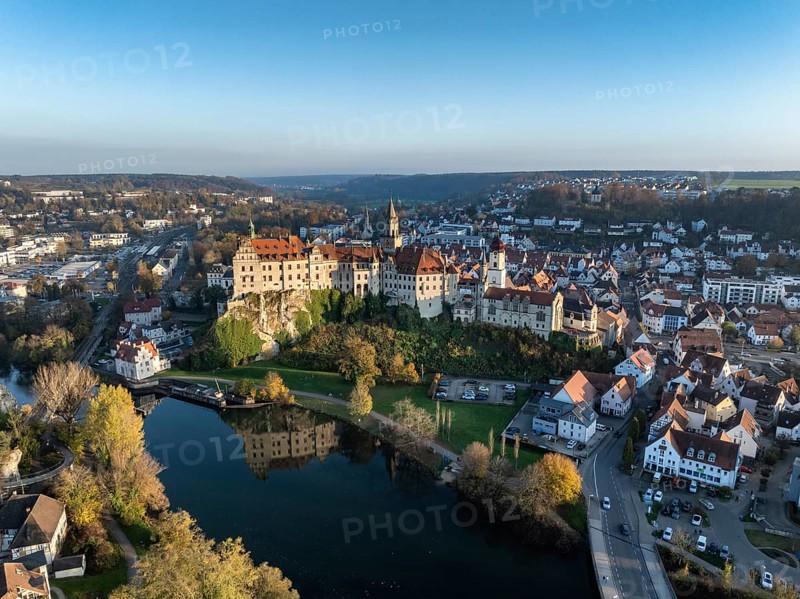 Aerial view of the town of Sigmaringen with the Hohenzollern Castle, a sight and tourist attraction above the old town and the Danube with autumnal vegetation, Danube valley, district of Sigmaringen, Baden-Württemberg, Germany, Europe