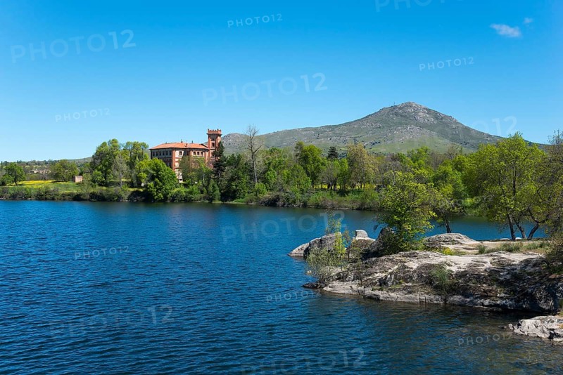 Clear lake next to a building, surrounded by nature and mountains under a blue sky, palace, Palacio de Santa Cecilia, Embalse de Pontón, Ponton reservoir, La Granja de San Ildefonso, Castilla y León, Castile and Leon, Spain, Europe