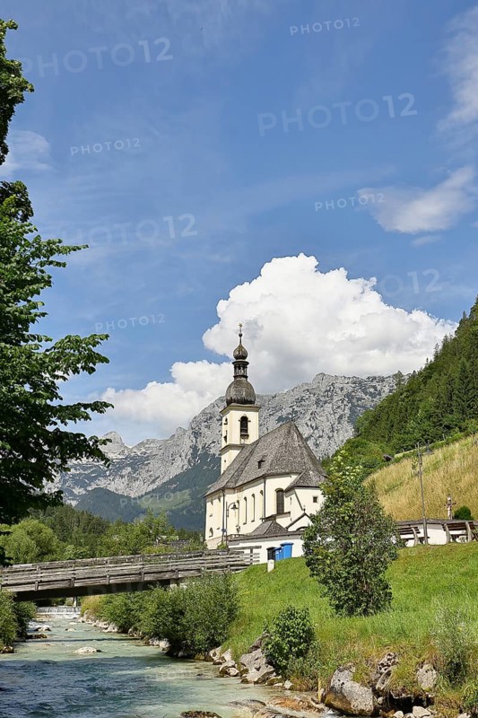 Parish church of St. Sebastian in autumn with Ramsauer Ache, Reiteralpe in the background, Ramsau, Berchtesgaden, Berchtesgadener Land, Upper Bavaria, Bavaria, Germany, Europe