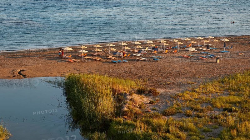 Evening light, beach, umbrellas, wetland, sedge, Frangokastello, Venetian fortress, castle, Sfakia, West Crete, south coast, island of Crete, Greece, Europe