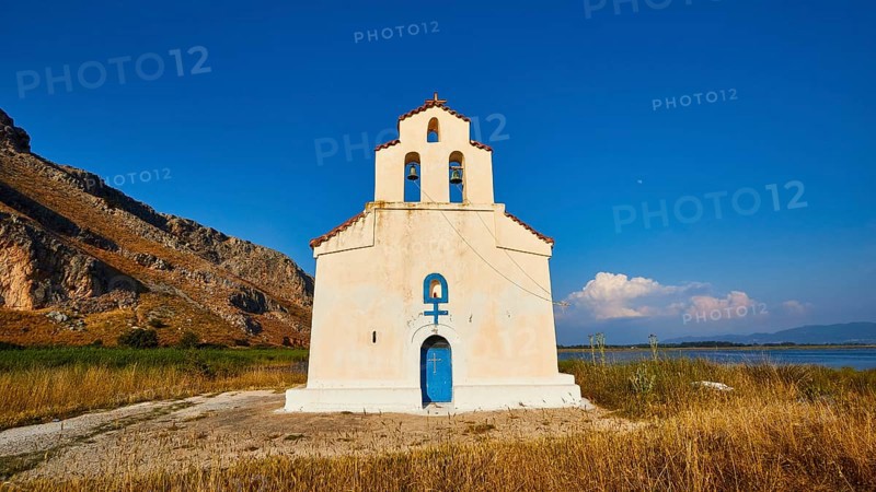 Agiou Petrou Chapel, Chapel of St Peter, Lonely church under a bright blue sky, surrounded by dry grass, Strofilia biotope, wetlands, Kalogria, Peloponnese, Greece, Europe