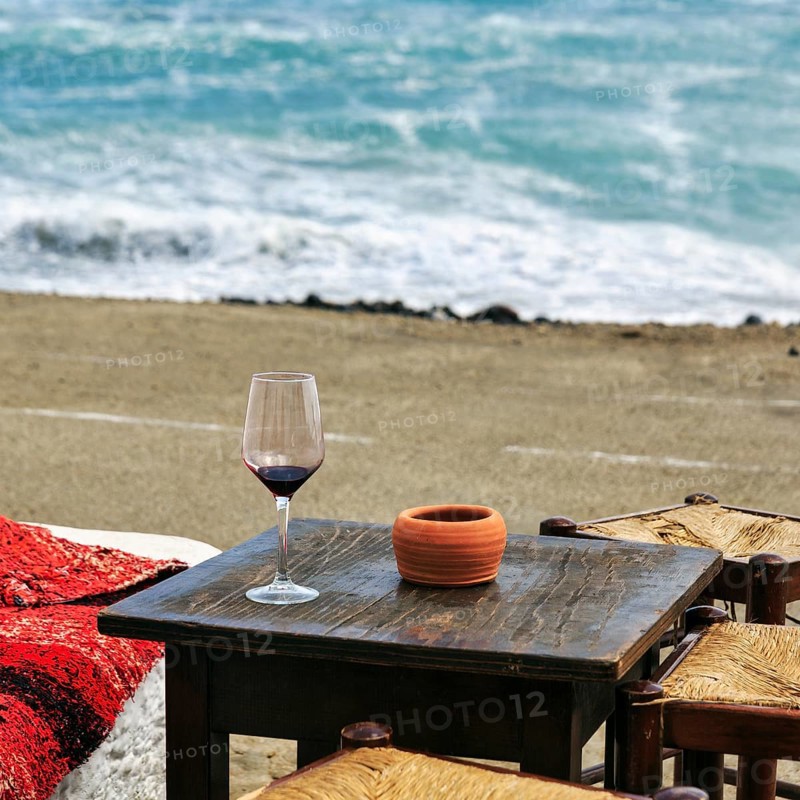 Empty wine glass on simple wooden outdoor table, bar, beach bar, Cabo-de-Gata-Nijar, Cabo de Gata, Las Negras, Almeria, Andalusia, Spain, Europe