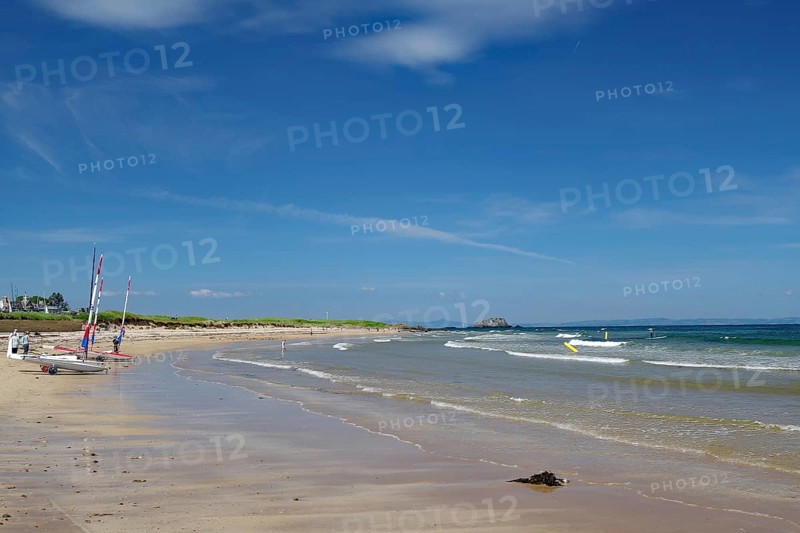 Quiet beach with boats on the shore and blue sky with scattered clouds, North Berwick, Scotland, United Kingdom, Europe