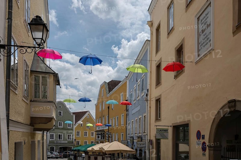 Colourful umbrellas stretched across the street, promising a prosperous and perfect life, Schärding, Lower Austria, Austria, Europe