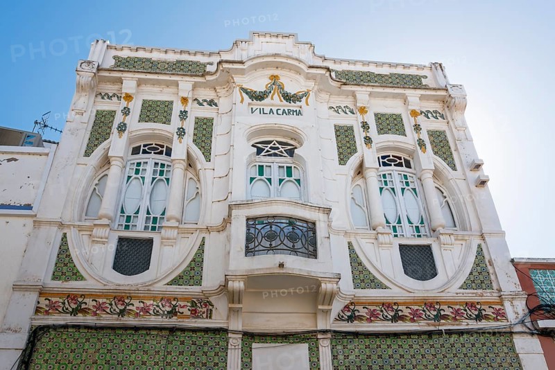 Historic Art Nouveau façade of a villa with green and white decorations and ornate windows, Villa Carma with azulejos, Fuseta, Fuzeta, Faro, Algarve, Portugal, Europe