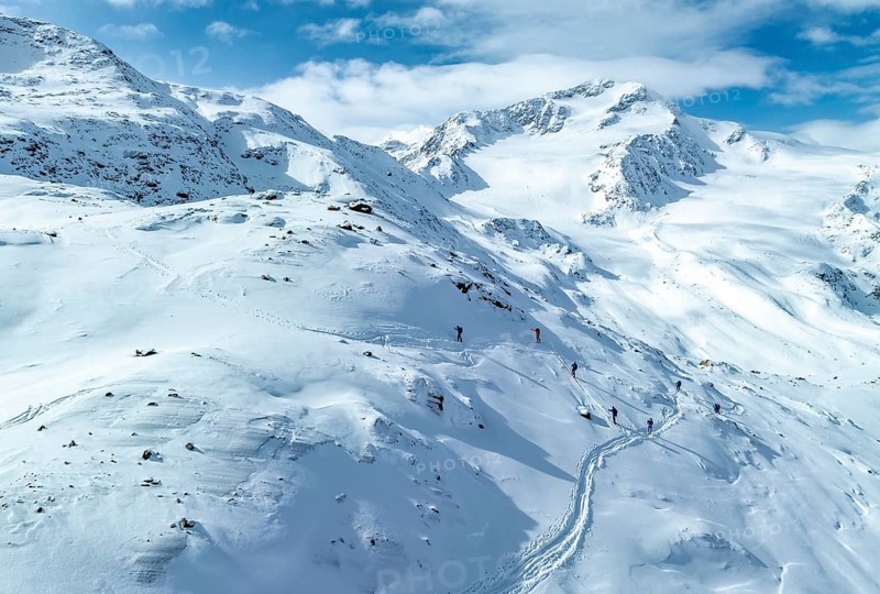 Aerial view, snowy mountain landscape, ski tourers on the ascent, behind Cevedale, Ortler group, Trento, Italy, Europe