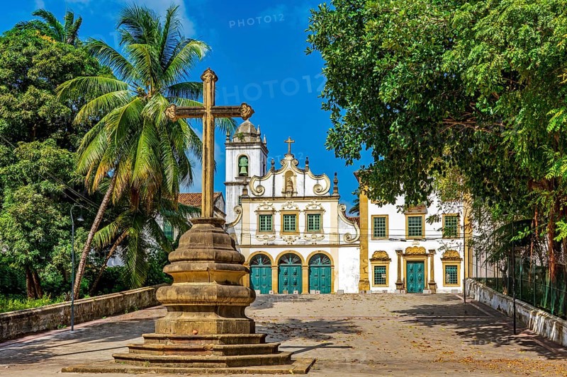 Square with historic baroque church and stone crucifix in Olinda, Pernambuco, Brazil, South America
