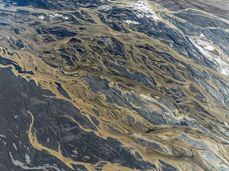 Aerial view, glaicial streams flow across Mælifellssandur, black sand desert, Icelandic highlands, Iceland, Europe