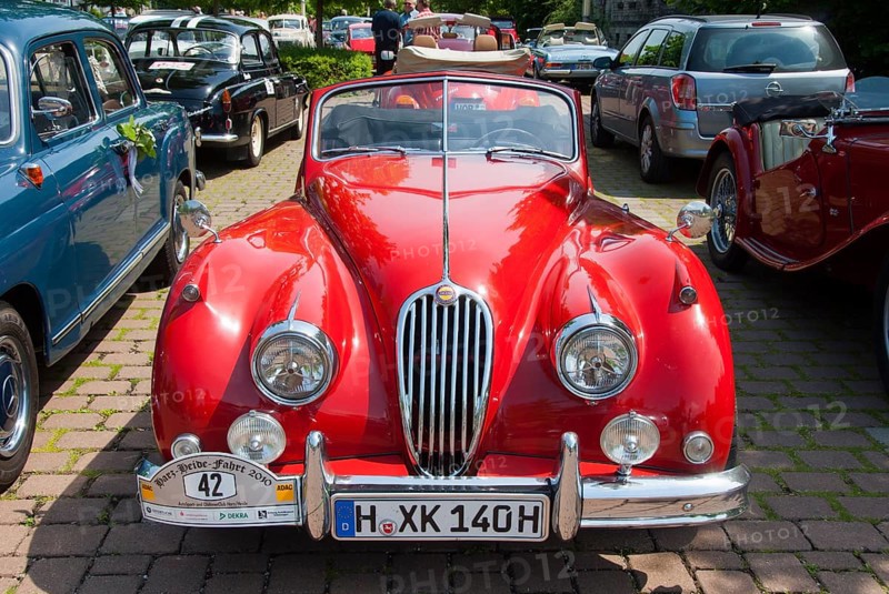 Red convertible from the classic car era, shining in the sun, classic car, convertible, Jaguar XK 140 convertible, Lower Saxony, Germany, Europe