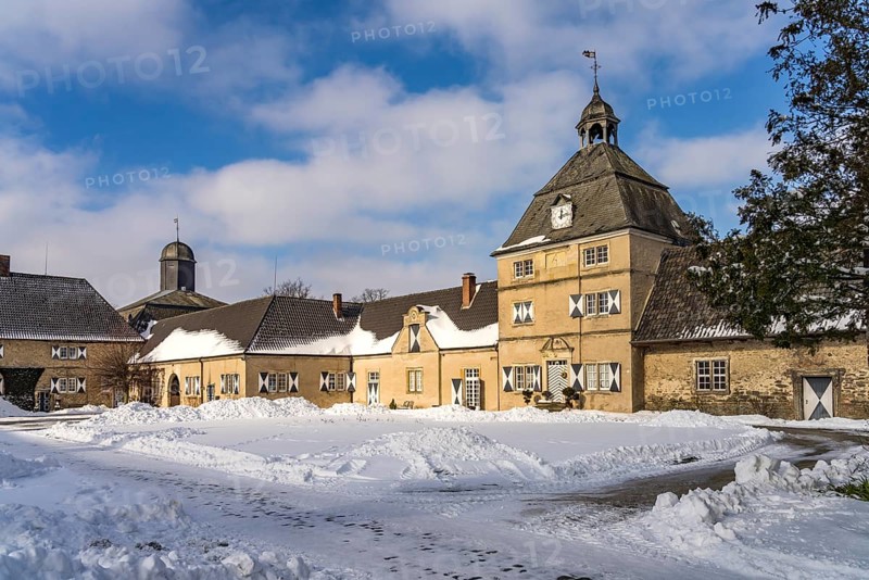 The snow-covered Westerwinkel Castle in winter, Herbern, Ascheberg, Münsterland, North Rhine-Westphalia, Germany, Europe