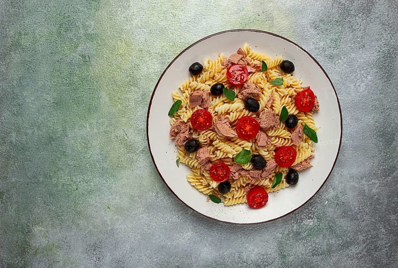 Tuna salad, fusilli pasta, olives and cherry, olive oil, homemade