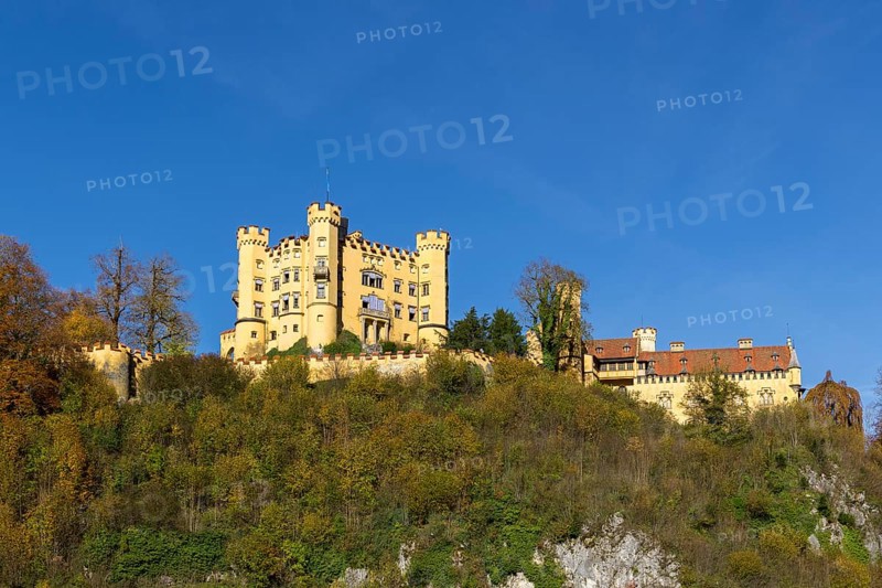 An impressive castle on a wooded hill with rocky ground, Hohenschwangau Castle, Schwangau, Königswinkel, romantic road, Ostallgäu, Allgäu, Swabia, Bavaria, Germany, Europe