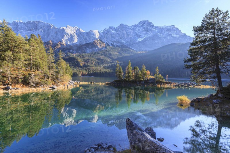 Steep mountains reflected in lake, evening light, autumn, Eibsee lake, Zugspitze, Bavaria, Germany, Europe