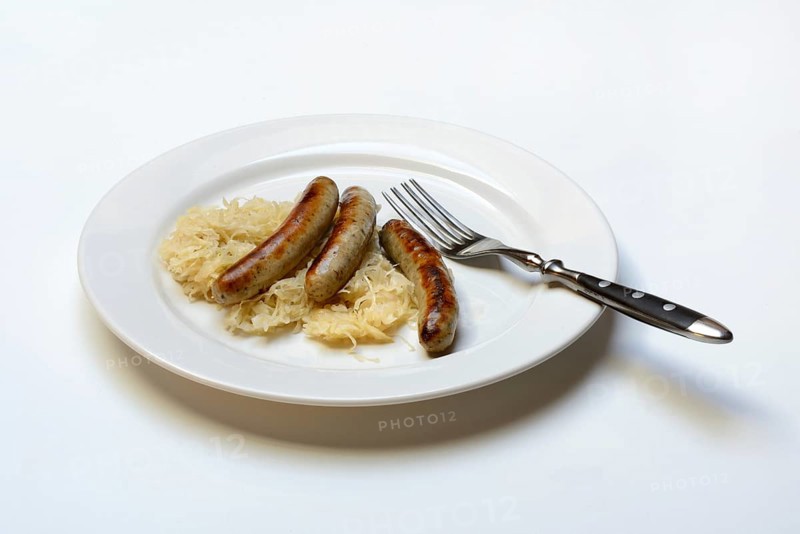 Nuremberg sausages with sauerkraut on a plate, Rostbratwurst, Germany, Europe