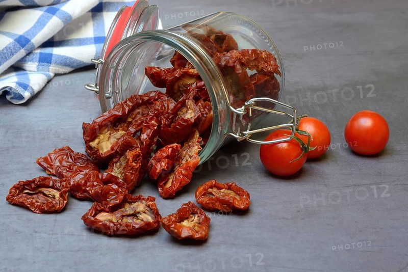 Dried tomatoes in glass containers, Solanum lycopersicum