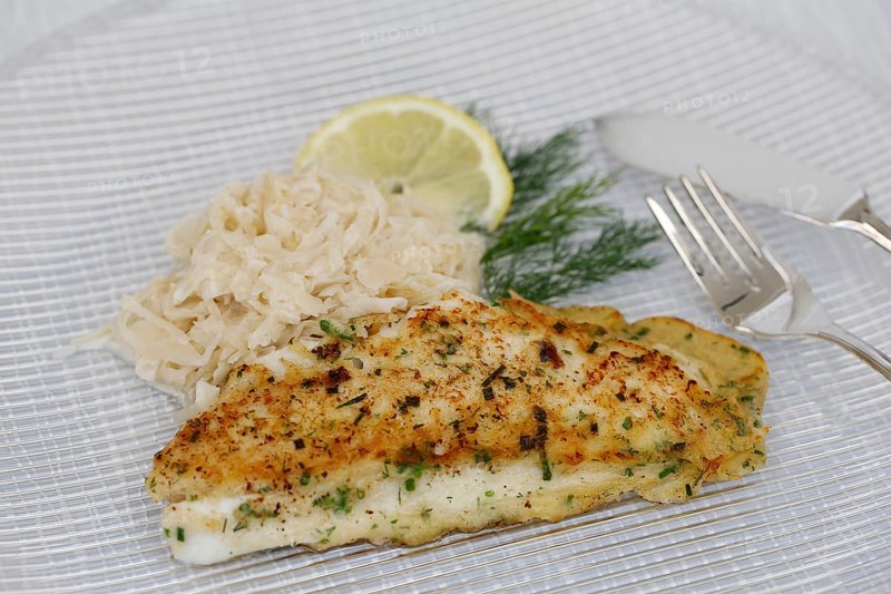 Swabian cuisine, fillet of Lake Constance whitefish with herbs and creamed cabbage, sauerkraut, fish dish, freshwater fish, served on a plate, dill, lemon slice, fish cutlery, typical Swabian cuisine, traditional cuisine reinterpreted, food photography, studio, Germany, Europe
