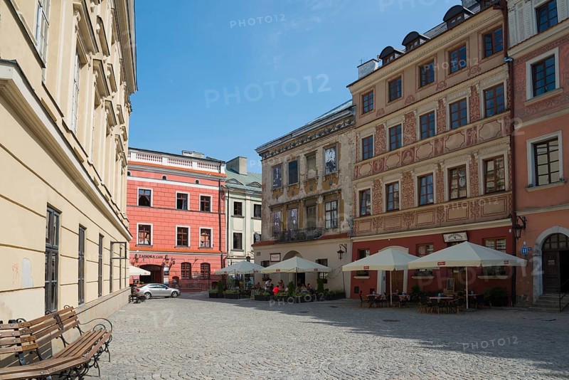 Cobbled old town alleyway with historic buildings and sunlight, benches at the roadside, Old Town Market Square, Lublin, Poland, Europe